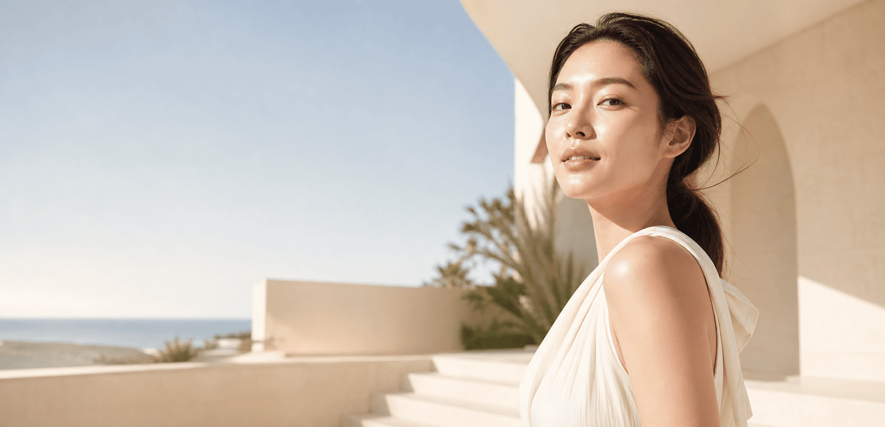 Woman with luminous skin in bright Australian coastal sunlight