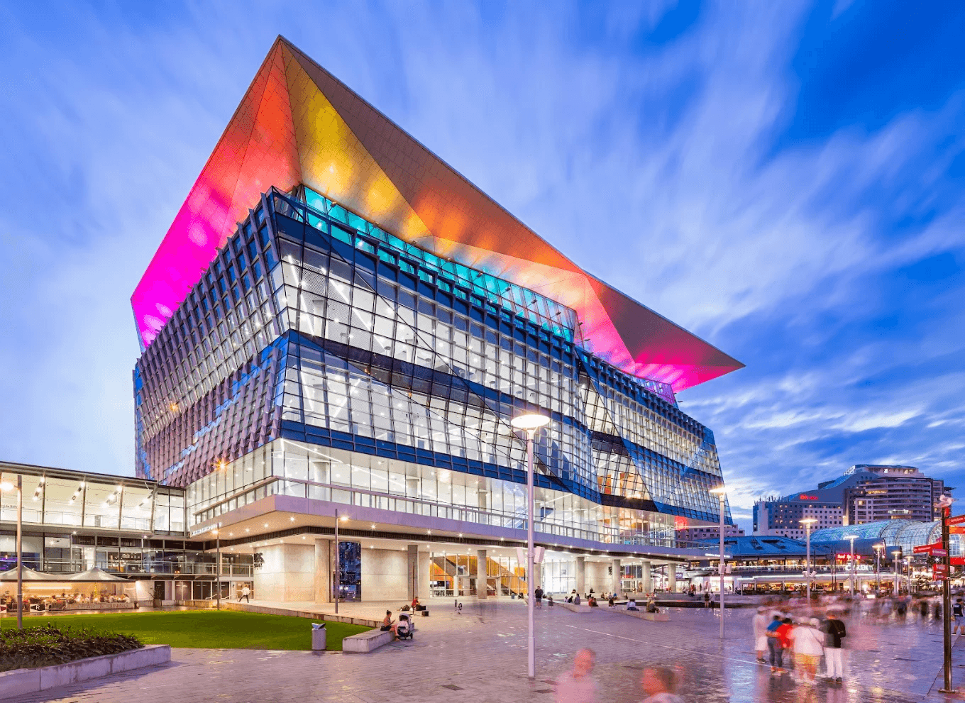 ICC Sydney Exhibition Centre at Darling Harbour illuminated at dusk