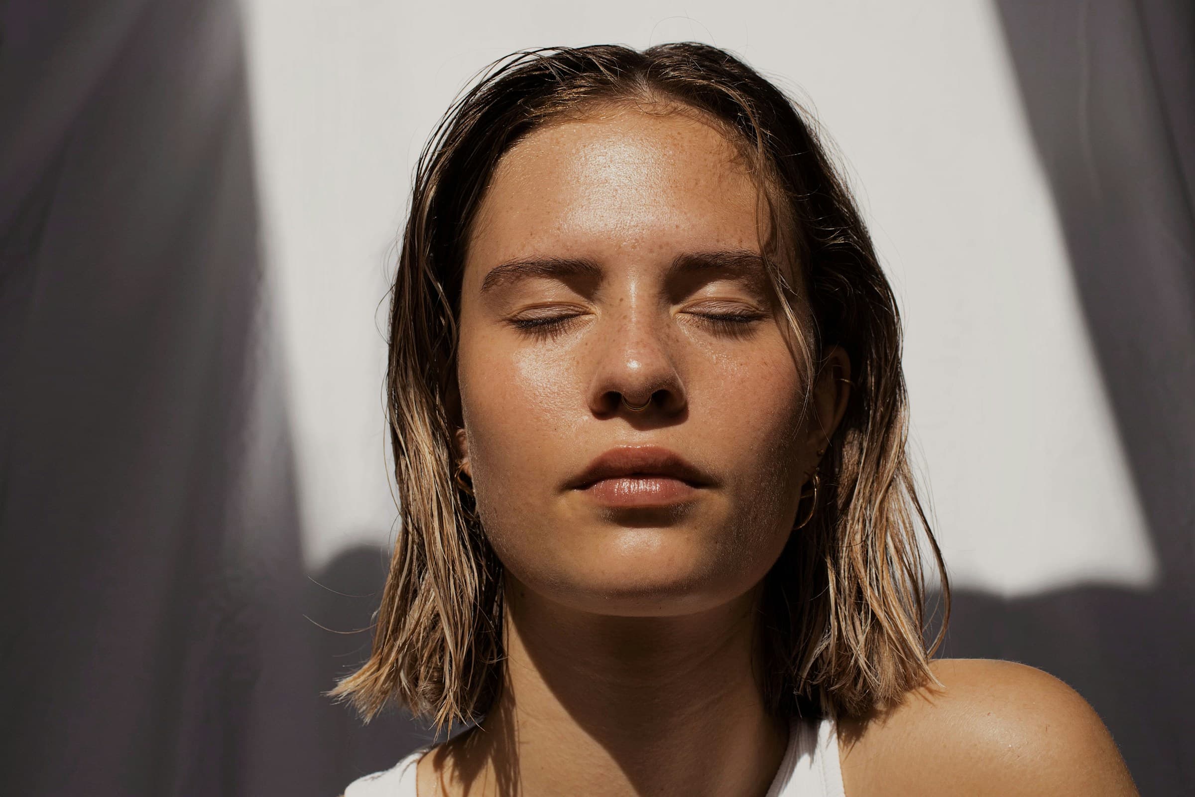 Close portrait of radiant finished skin in natural light